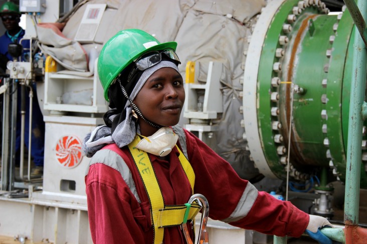 A worker inspects equipment at the Olkaria Geothermal Plant in Kenya. (Photo: Carole Douglis/USAID West Africa)