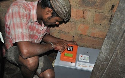 A man works on an electrical box