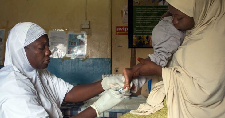A nurse takes a blood sample for dry blood test for HIV from a child in Minna, Niger state.