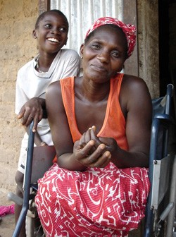 Photo of a woman in a wheel chair with a young boy