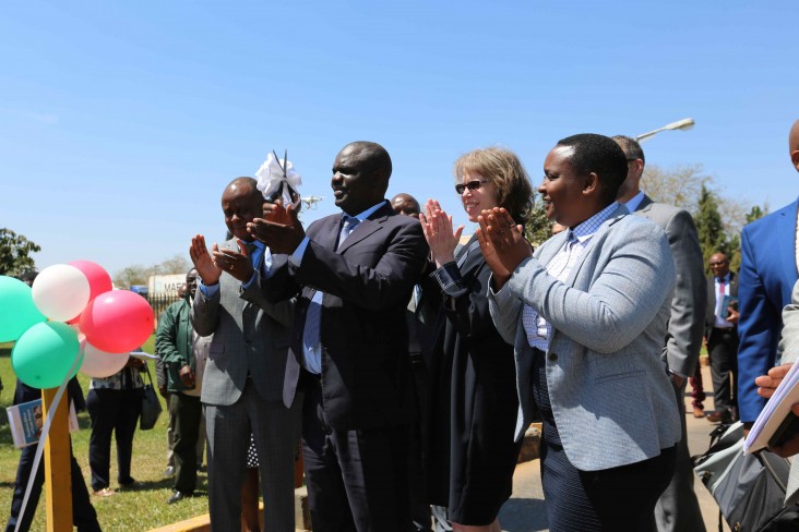 USAID Zambia Director, Sheryl Stumbras; Acting Permanent Secretary, Ministry of Agriculture, Mr. Morgan Malambo; and Seed Co. Limited Managing Director Grace Bwanali celebrate the first SADC seed shipment leaving Seed Co. Limited headquarters on September 9, 2019.