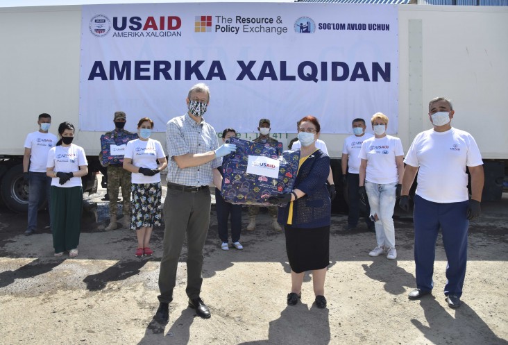 U.S. Ambassador handing over supplies to Sog’lom Avlod Uchun for families affected by Sardoba Dam Breach