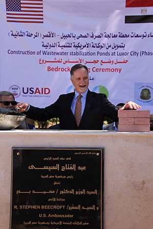 U.S. Ambassador to Egypt Stephen Beecroft lays a ceremonial brick at the groundbreaking of the Luxor wastewater treatment plant expansion.