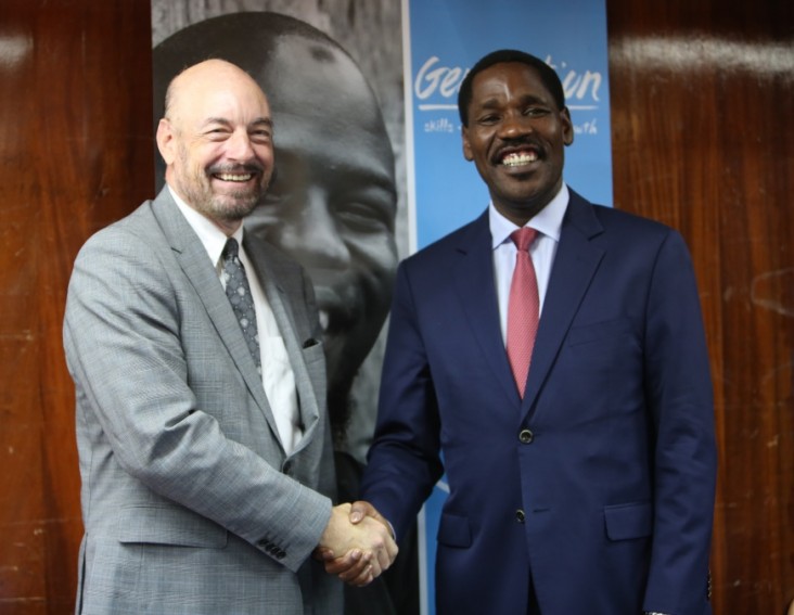 USAID Mission Director for Kenya and East Africa Mark Meassick (L) and the Trade and Industry Cabinet Secretary Peter Munya during the Generation Kenya graduation ceremony. USAID supports the initiative which trains youth to learn the skills they need for entry-level jobs.