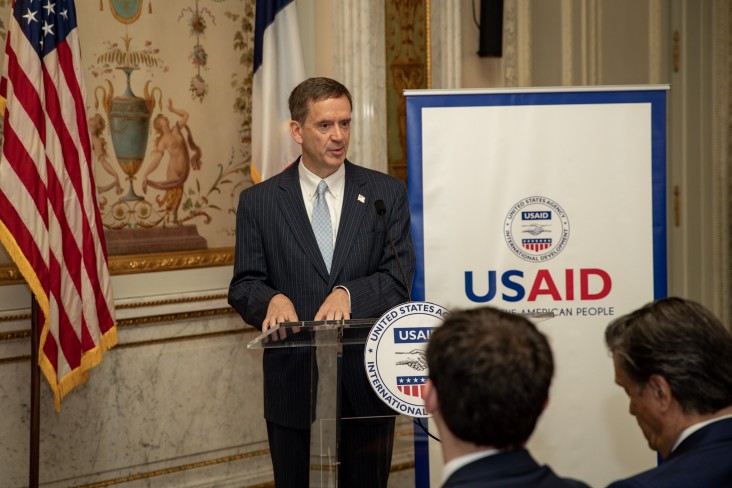 Administrator Mark Green speaks at a podium at the George C. Marshall Center, Paris, France