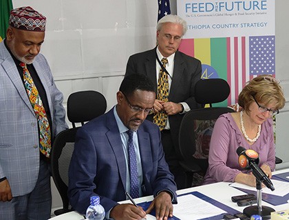 Image of Ethiopia Minister of Agriculture and USAID Deputy Administrator Glick signing Feed the Future partnership