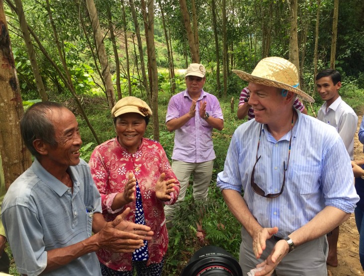 U.S. Ambassador Ted Osius talks to local people about their livelihoods after the launch.