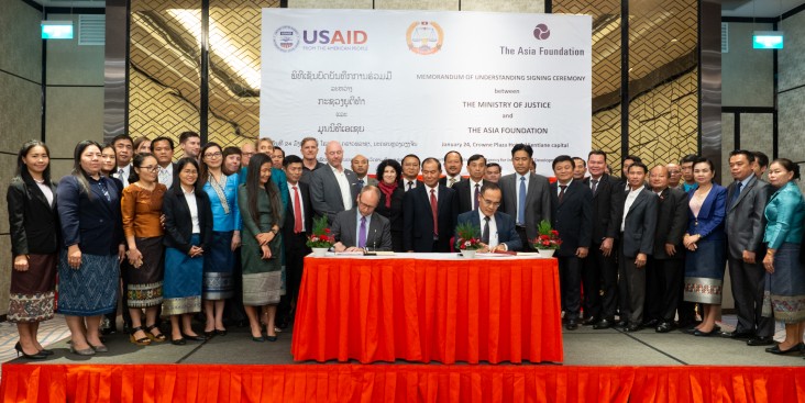From center left to right: U.S. Ambassador Rena Bitter and Minister of Justice Mr. Xaysi Santivong witnessed the MOU signing between Mr. Todd Wassel, Country Representative for The Asia Foundation in the Lao PDR and Mr. Ketsana Phommachanh, Director General of International Cooperation, Ministry of Justice.