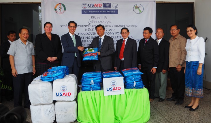 From (third left) U.S. Deputy Chief of Mission to Lao PDR Michael Kleine presented 120,000 mosquito nets to the Deputy Minister of Health, H.E. Assoc. Prof. Dr. Phouthone Muongpak during a ceremony in Vientiane.  