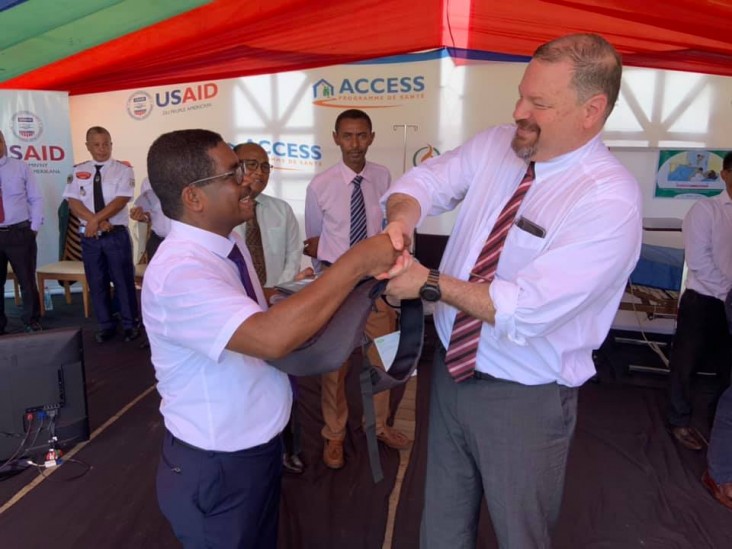 USAID Mission Director John Dunlop (right) ceremonially hands over $4.5 million of medical supplies to the Madagascar Minister of Public Health, Prof. Julio Rakotonirina.