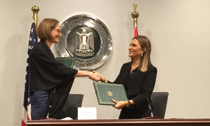 USAID/Egypt Mission Director Sherry F. Carlin and Minister of Investment and International Cooperation Dr. Sahar Nasr shake hands after signing bilateral assistance agreements worth $16.5 million.