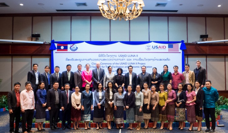 U.S. Ambassador Rena Bitter (top row, center) joins Minister of Industry and Commerce Khemmani Pholsena and 40 other representatives from the Lao government, the U.S. Embassy, and the private sector during the closing ceremony of the USAID LUNA II project in Vientiane.