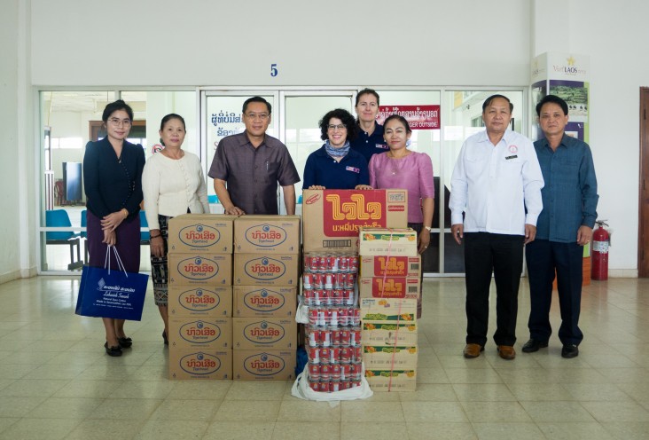 Vice Governor of Savannakhet Province Phoxay Sayasone (third from left) accepted some donated food and water from U.S. Ambassador Rena Bitter (center) on as part of the U.S. support for emergency relief in Southern Laos on September 13, 2019.