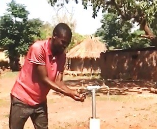 A rural resident in Zambia's Eastern provinces accesses piped water for the first time.
