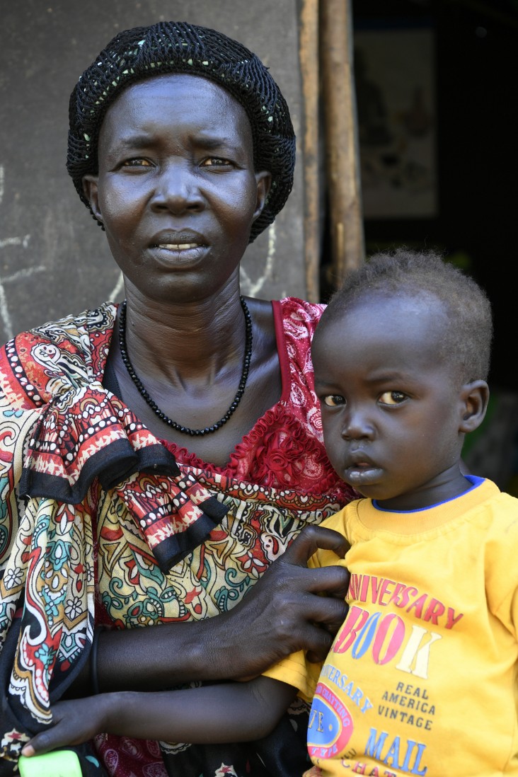 Nyantau Machoch, a South Sudanese refugee who fled conflict to neighboring Ethiopia, with one of her six children.