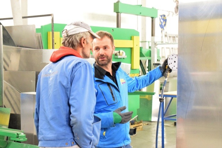 Suad Beslic (R) spends every available moment with his workers in his factory in Zivinice, Bosnia and Herzegovina.