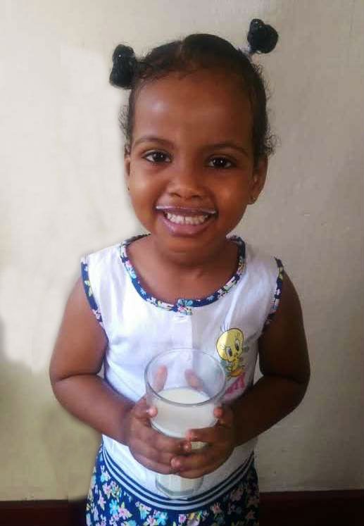 A Somali child loving her milk every morning