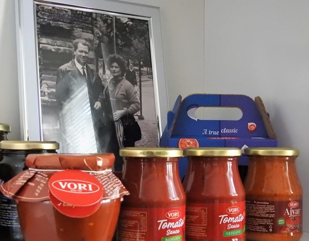 Vori’s products in front of a photo of the founder and his wife