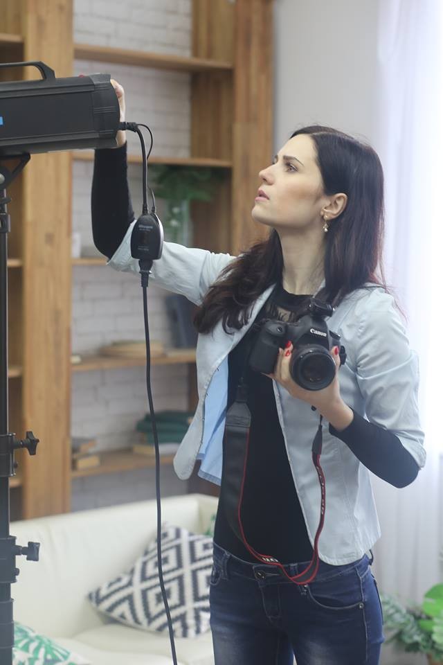 Valentina Ushakova checks equipment before photo shoot.