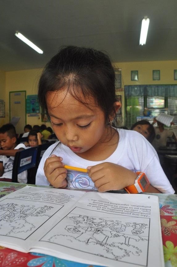 Young Girl in Rural Philippines Braves the Sea to Read and Learn