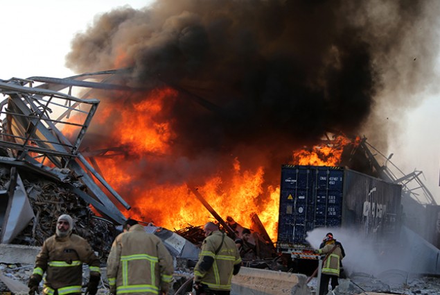 Lebanese firefighters extinguish fire at the scene of an explosion at the port in the  capital Beirut on August 4, 2020. 