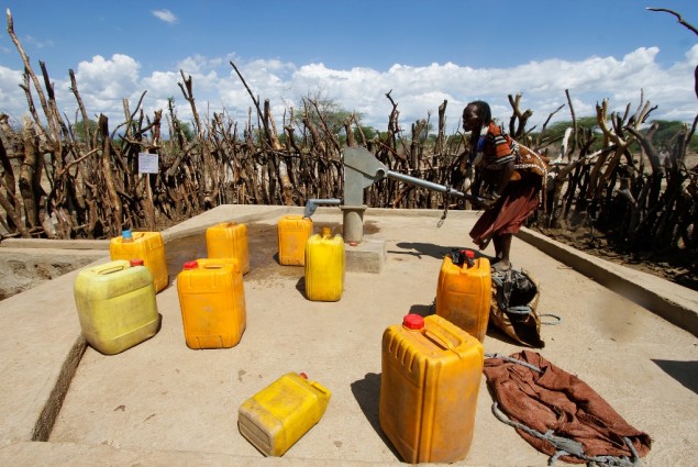 Image of woman pumping water in Ethiopia