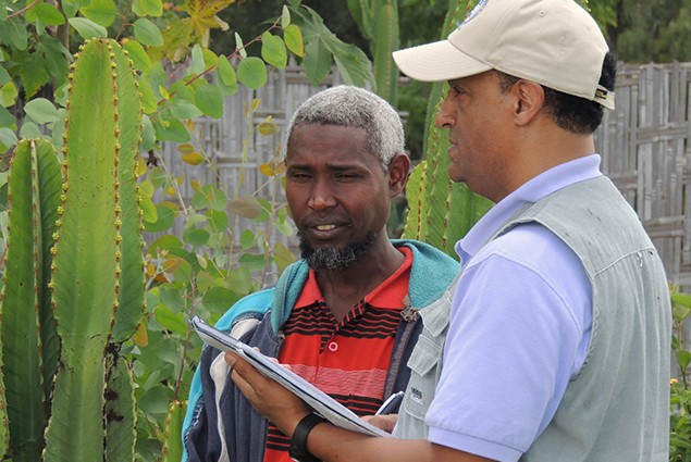 OFDA staff discussing plant health issues with a participating farmers near Shashamane, Ethiopia