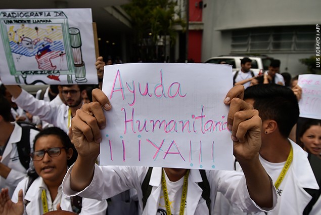 Workers of the University Hospital demand humanitarian aid during a protest against the government of President Nicolas Maduro.