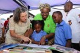 ission Director Jennifer Admas, Minister of Education Carmelita Namachulua and two Pupils at the Celebrations of Mother Language Day