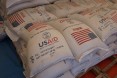 Fifty kilogram bags of wheat provided through the assistance of the American people are stored inside prior to distribution.