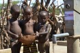 Image of children in Ethiopia at a water pump built by USAID