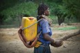 Image of woman in Ethiopia carrying water jug