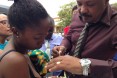 visiting official administers polio to infant