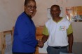 Shaking hands with a Community Health Volunteer