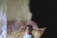 child under a bednet in Ranomafana
