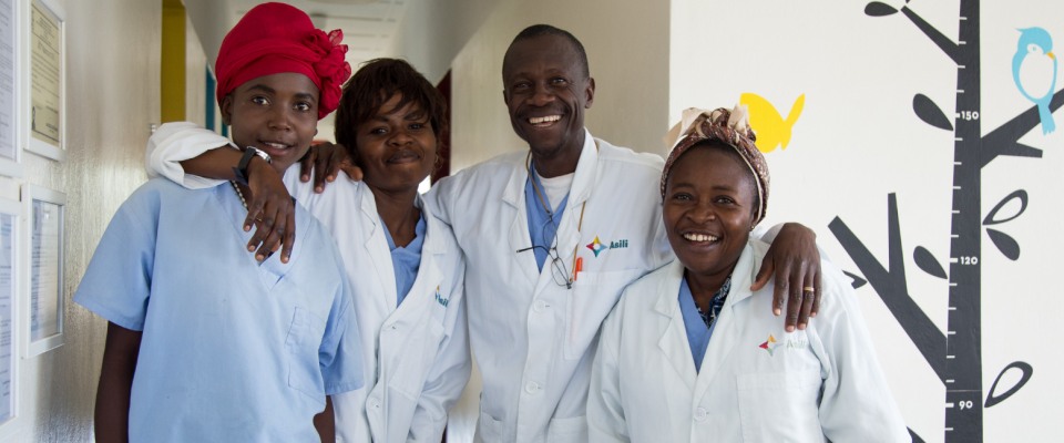 A group of 4 medical workers pose together