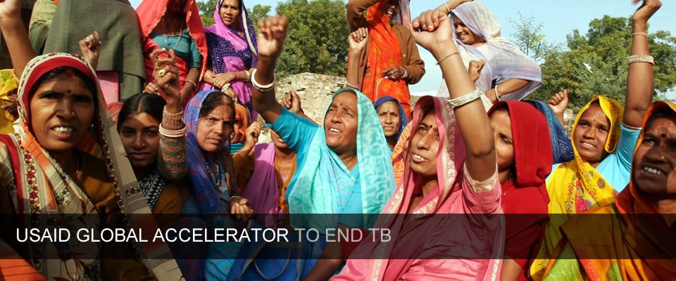 A group of Indian women raise their hands in solidarity against TB. Caption reads: USAID Global Accelerator to End TB