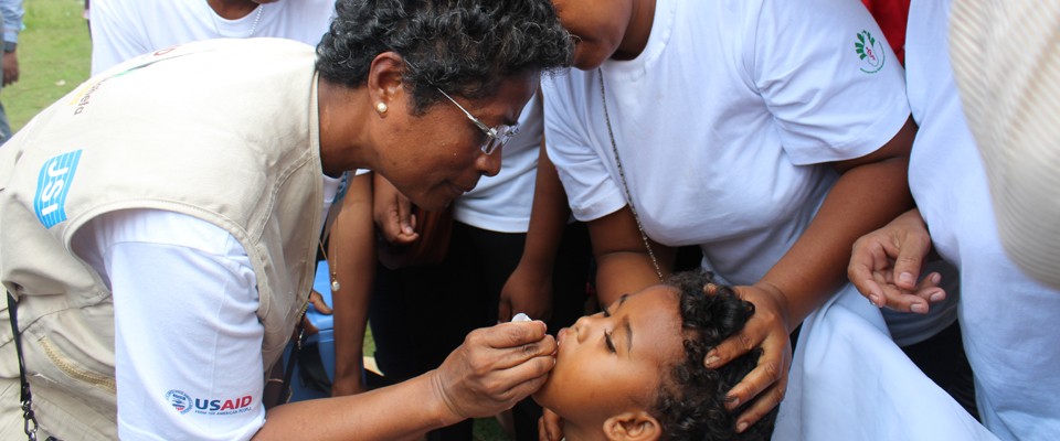 A child is given a vaccine