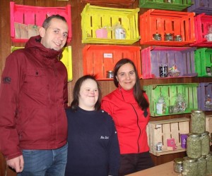 Businessowner Irma Zerdo, right, with employees Edin Islamović and Berina Zerdo, in front of Cvetak's display of herbal teas