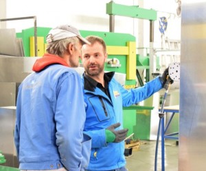 Suad Beslic (R) spends every available moment with his workers in his factory in Zivinice, Bosnia and Herzegovina.