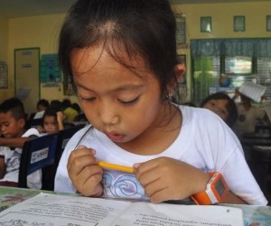 Young Girl in Rural Philippines Braves the Sea to Read and Learn