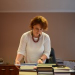 Chief Judge Enkeledi Hajro of the Tirana District Court reviews her documents.