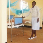 A nurse at the Kibaigwa Health Center shows off the newly completed women’s ward.