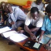 A Yumbe survey team learns how to use electronic tablets to collect data on trachoma.