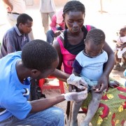 A young boy is tested for malaria as part of the Impact Malaria project