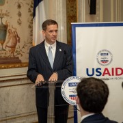 Administrator Mark Green speaks at a podium at the George C. Marshall Center, Paris, France