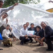 U.S. Ambassador Rena Bitter and Lao Vice Minister of Health Khamphone Phoutthavong Tried out Bednets during a Handover Ceremony in Vientiane