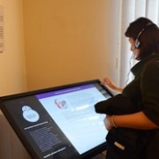 A woman explores a digital display at the media museum.