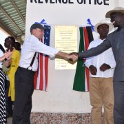 U.S. Ambassador to Kenya, Robert Godec, shakes hands with the Governor of Turkana County, Josphat Nanok after officially opening the Lodwar Livestock Market. Looking on is the Cabinet Secretary for Arid and Semi-arid Lands Eugene Wamalwa and USAID’s Deputy Mission Director Heather Schildge.