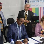 Image of Ethiopia Minister of Agriculture and USAID Deputy Administrator Glick signing Feed the Future partnership